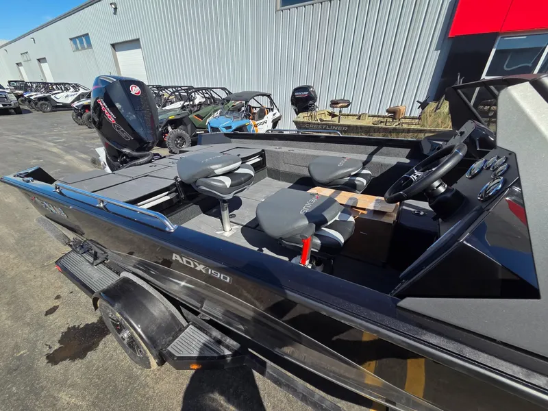 Slide: The Image of 2026 Vexus Boats ADX190 with outboard motor, modern features. - 9