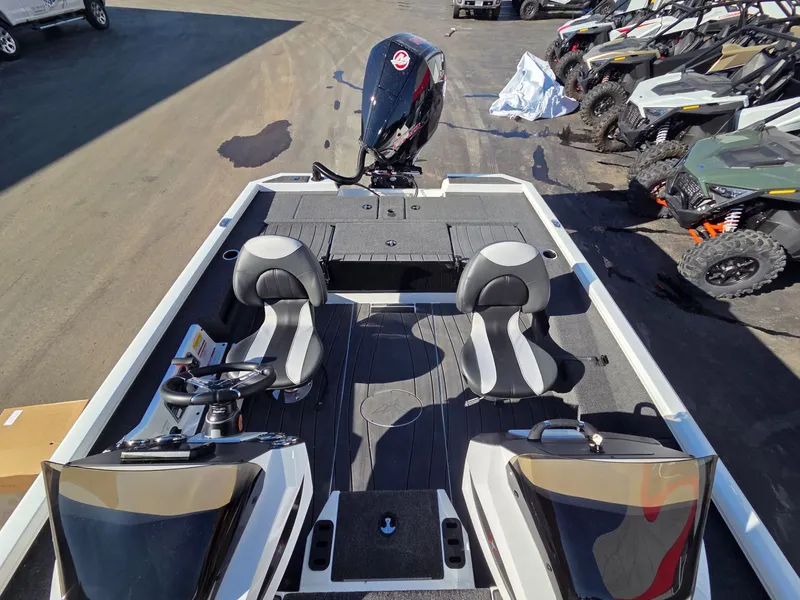 Slide: The Image of 2026 Vexus Boats AVX1985s with dual seats and motor on parking lot. - 19