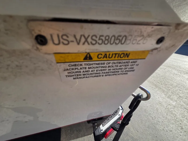 Slide: The Image of Vexus Boats AVX1985s 2026 serial number and caution label. - 37
