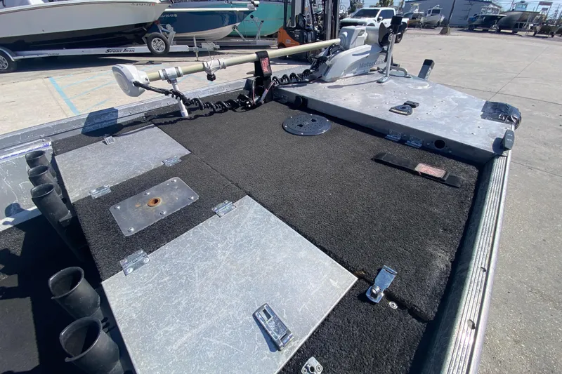 Slide: The Image of 1979 Monark 1648 Jon boat deck with fishing rod holders and trolling motor. - 10