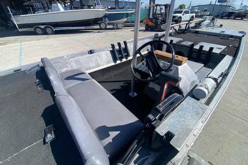 Slide: The Image of 1979 Monark 1648 Jon boat interior with steering wheel and seating. - 12