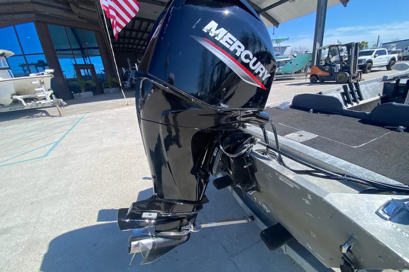 Slide: The Image of 1979 Monark 1648 Jon boat with Mercury outboard motor at a marina. - 14