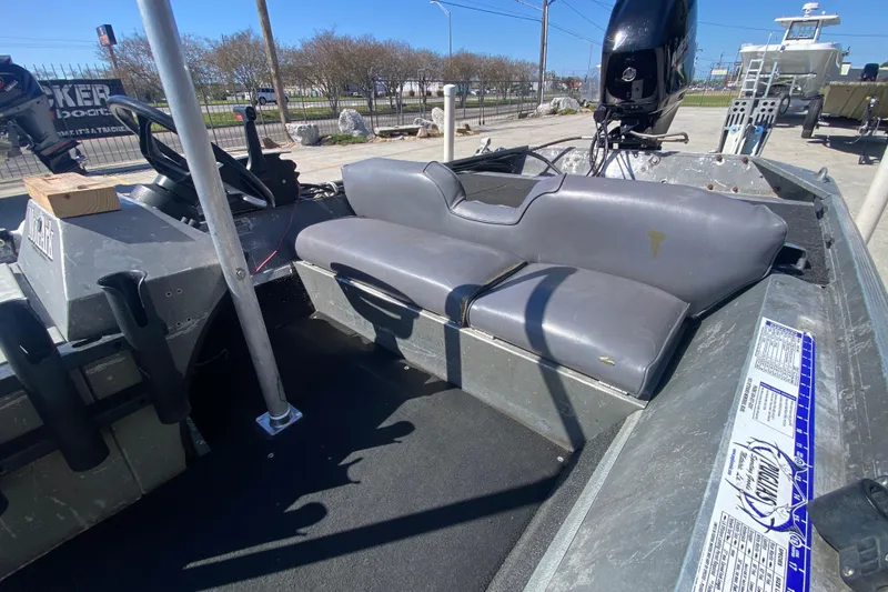 Slide: The Image of 1979 Monark 1648 Jon boat interior with gray seating and steering console. - 18