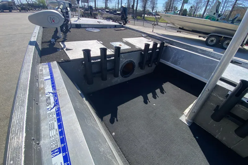 Slide: The Image of 1979 Monark 1648 Jon boat interior with rod holders and trolling motor. - 19