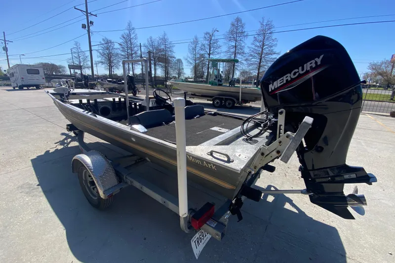 Slide: The Image of 1979 Monark 1648 Jon boat with Mercury outboard motor on trailer. - 5