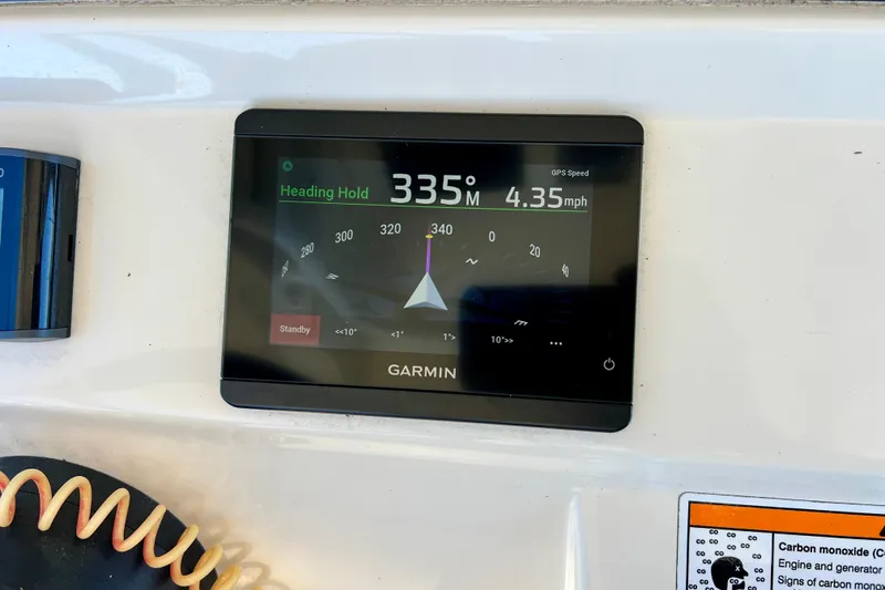 Slide: The Image of Garmin navigation display on 2024 Scout 277 LXF boat, showing heading and speed. - 13