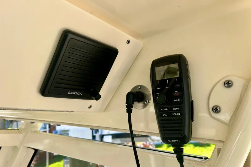 Slide: The Image of 2024 Scout 277 LXF boat with Garmin marine radio and speaker system. - 14