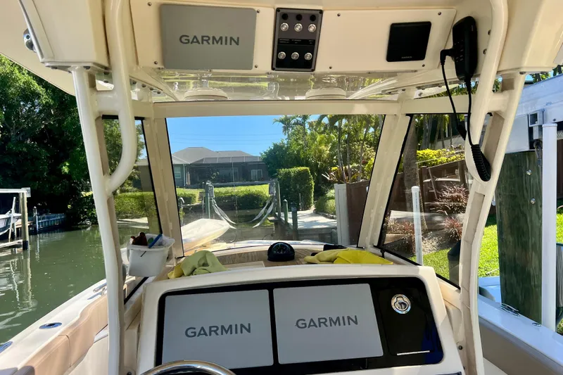 Slide: The Image of 2024 Scout 277 LXF boat interior with Garmin navigation system. - 15