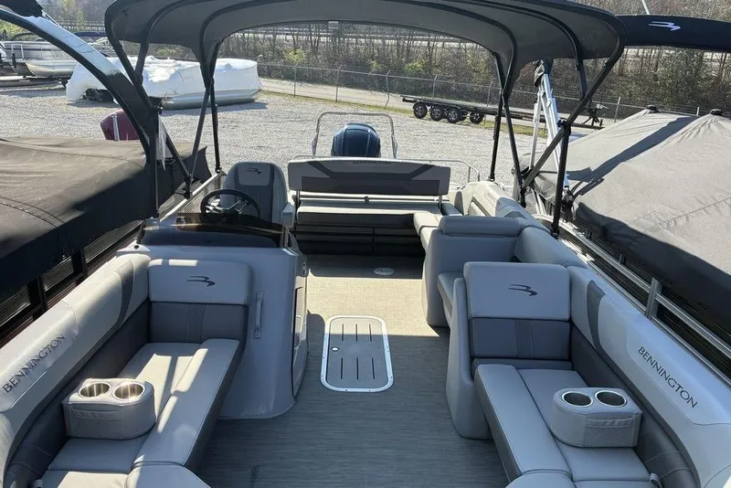 Slide: The Image of 2022 Bennington 22 SSBX pontoon boat with spacious seating and canopy. - 4