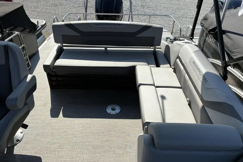Slide: The Image of 2022 Bennington 22 SSBX boat interior with gray seating and spacious layout. - 5