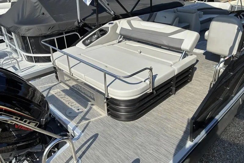 Slide: The Image of 2022 Bennington 22 SSBX pontoon boat with comfortable seating and sleek design. - 6