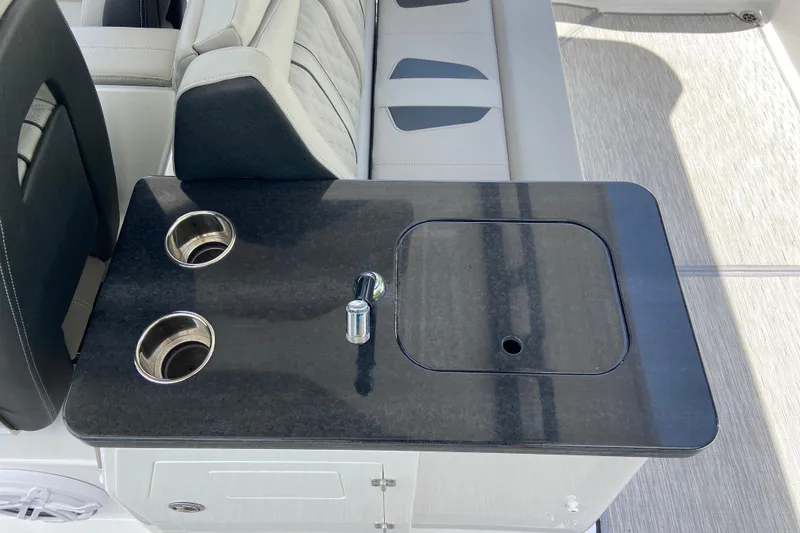 Slide: The Image of Luxury seating and countertop on 2026 Monterey Elite 30 OB boat, featuring cup holders. - 13