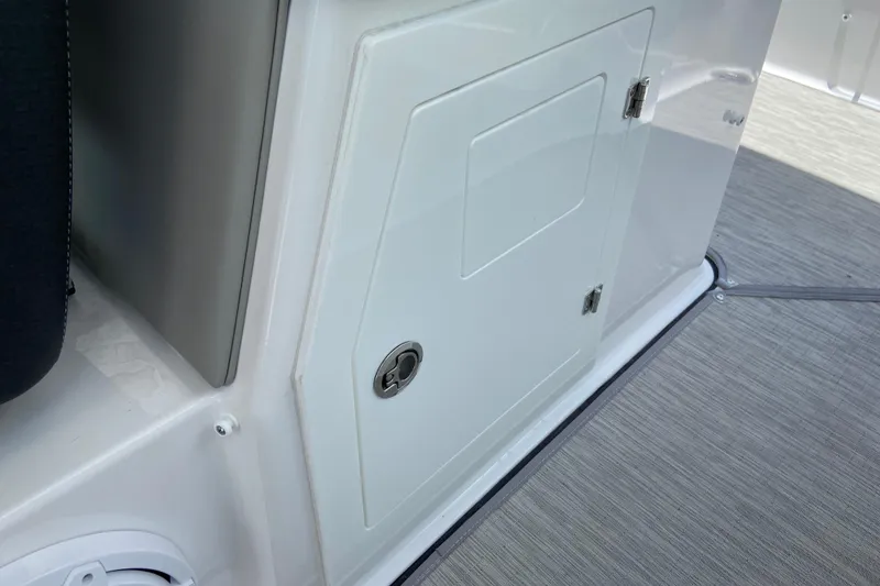 Slide: The Image of Storage compartment on 2026 Monterey Elite 30 OB boat, featuring sleek design and secure latch. - 17
