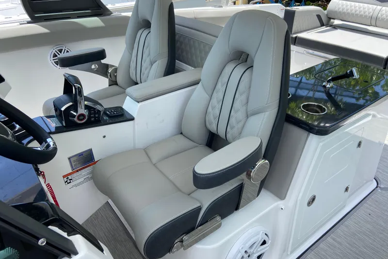 Slide: The Image of Luxury seating and controls in the 2026 Monterey Elite 30 OB boat cockpit. - 24