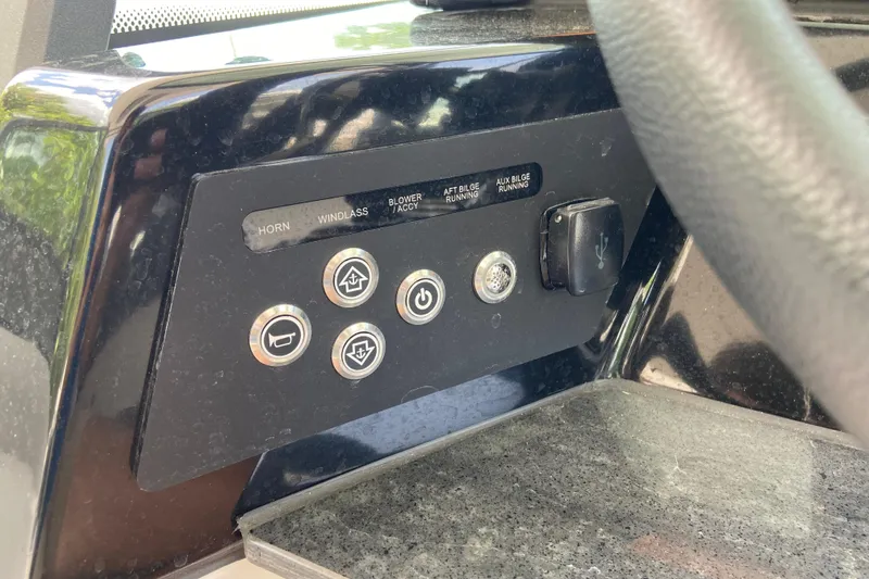 Slide: The Image of Control panel of 2026 Monterey Elite 30 OB boat with various function buttons. - 26