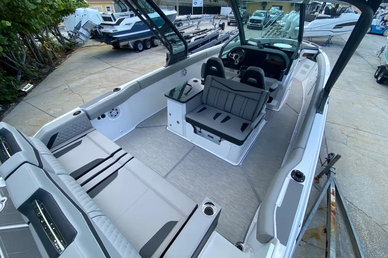 Slide: The Image of 2026 Monterey Elite 30 OB boat interior with modern seating and sleek design. - 3