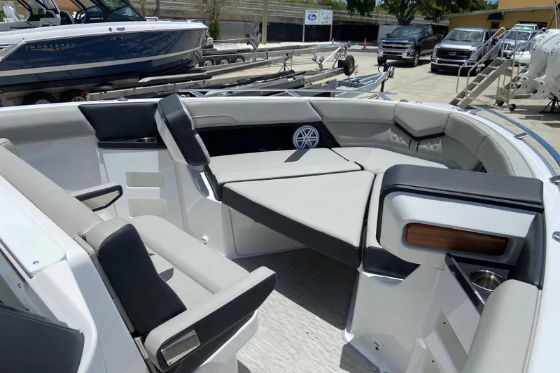 Slide: The Image of 2026 Monterey Elite 30 OB boat interior with luxurious seating and modern design. - 36