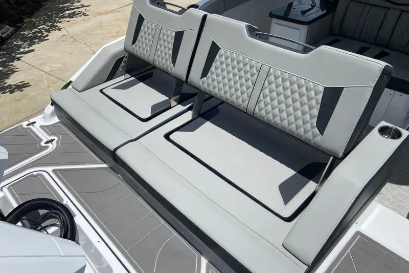 Slide: The Image of 2026 Monterey Elite 30 OB boat with stylish gray seating and modern design. - 4
