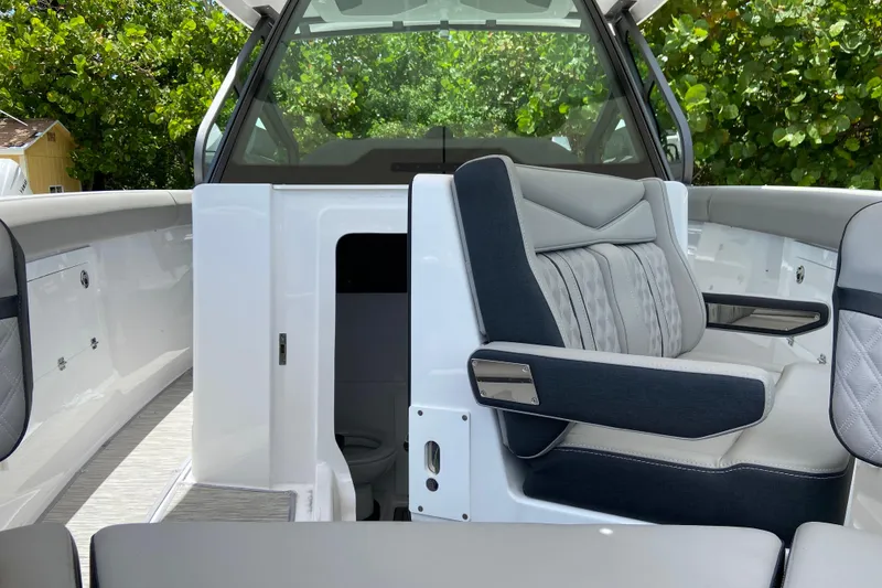 Slide: The Image of Interior of 2026 Monterey Elite 30 OB boat with luxurious seating and modern design. - 41