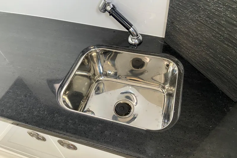 Slide: The Image of Stainless steel sink on Monterey Elite 30 OB, 2026 model, with sleek black countertop. - 45