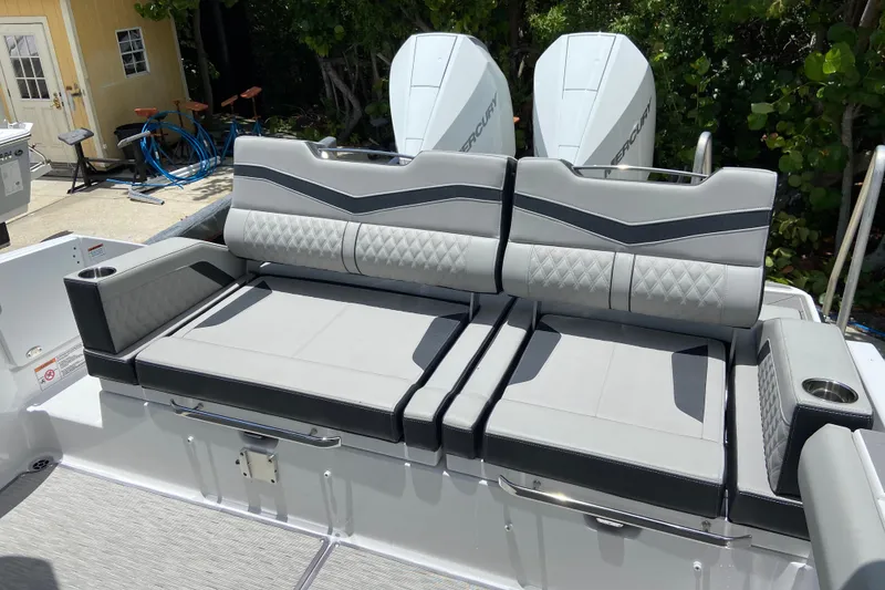 Slide: The Image of Luxury seating on 2026 Monterey Elite 30 OB boat with dual Mercury engines. - 5