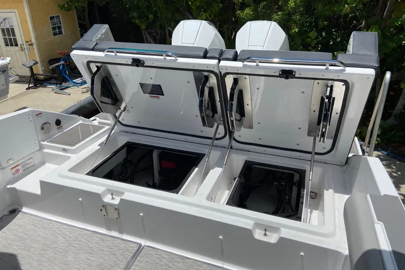 Slide: The Image of Open storage compartments on a 2026 Monterey Elite 30 OB boat. - 7
