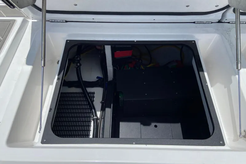 Slide: The Image of Open engine compartment of 2026 Monterey Elite 30 OB boat, showcasing internal components. - 8