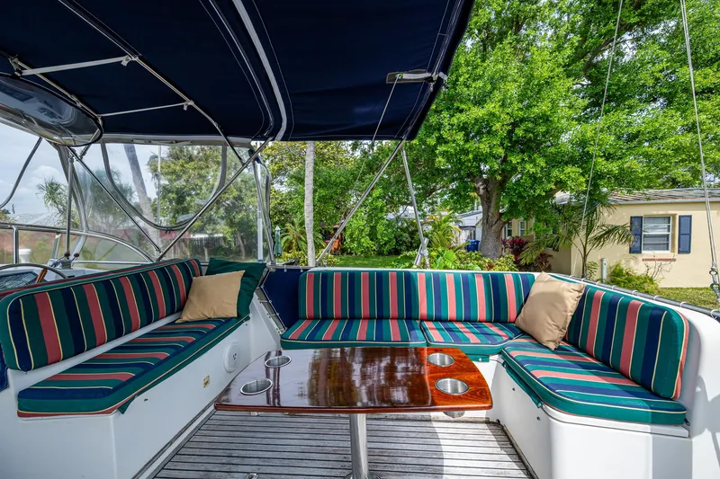 Slide: The Image of Spacious seating area on 1990 Grand Banks 46 Classic yacht with striped cushions. - 16