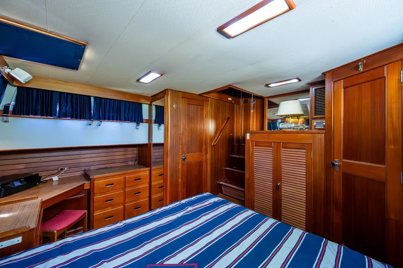 Slide: The Image of Luxurious wooden interior of a 1990 Grand Banks 46 Classic yacht cabin. - 40