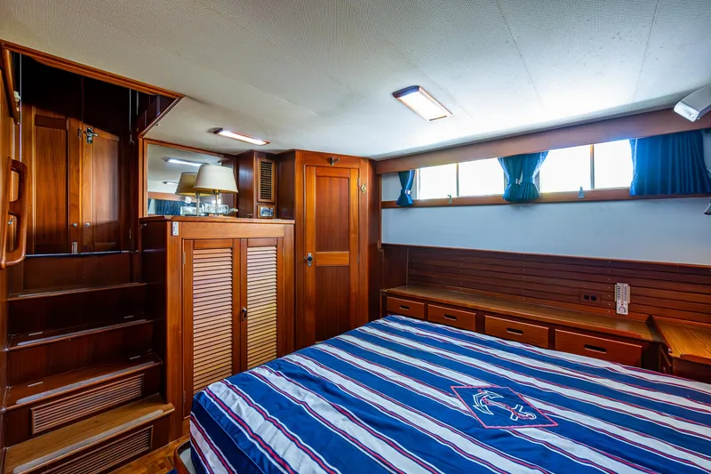 Slide: The Image of Luxurious cabin interior of 1990 Grand Banks 46 Classic yacht with wooden furnishings. - 44
