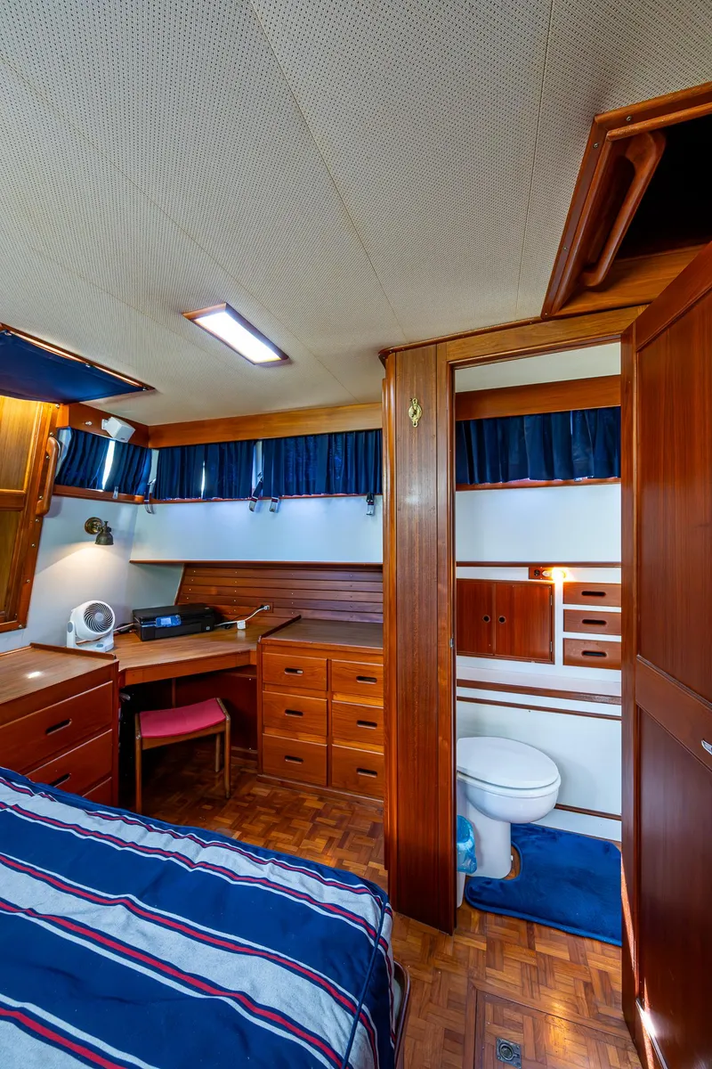 Slide: The Image of Interior of 1990 Grand Banks 46 Classic yacht with wood furnishings and cozy cabin layout. - 46