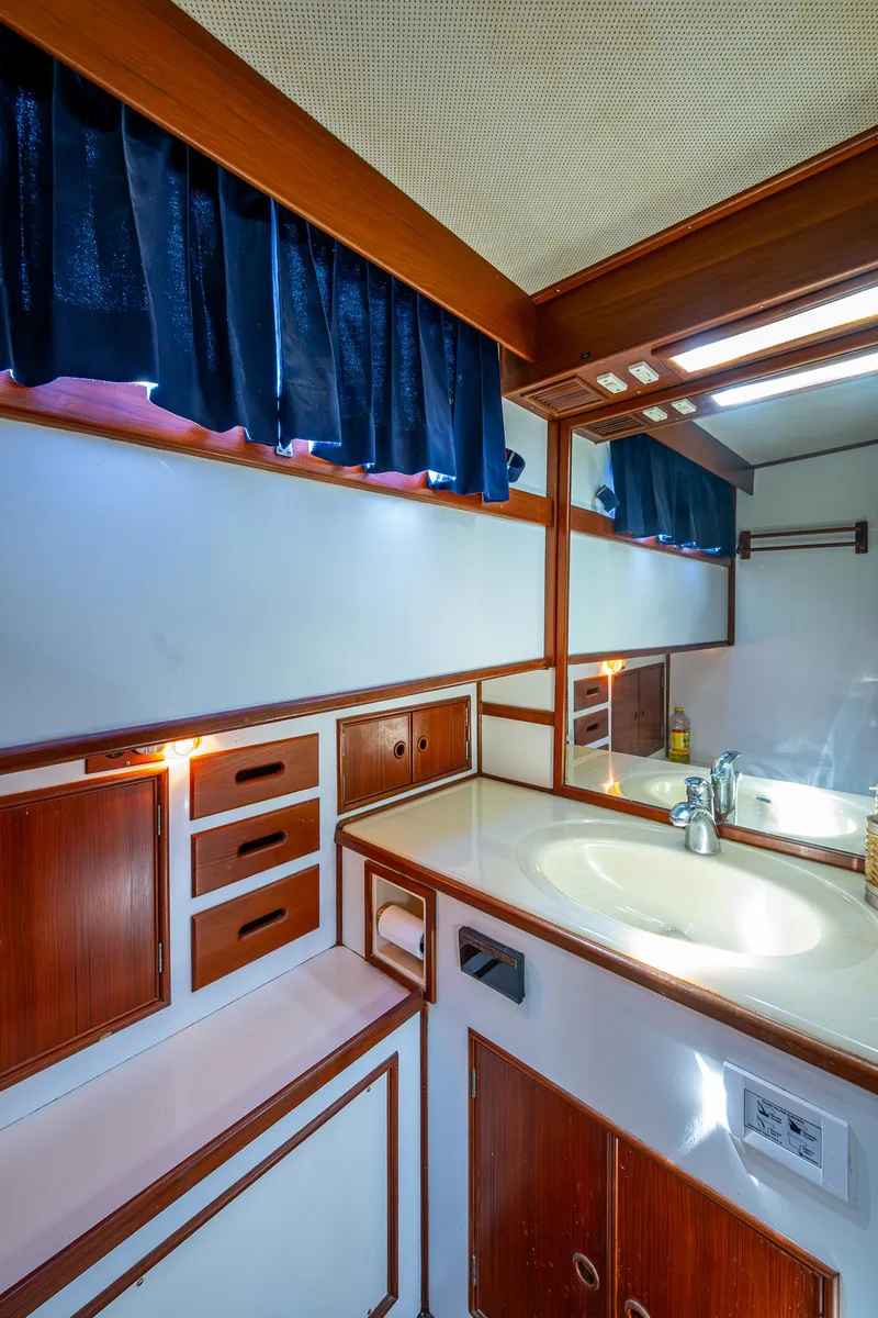 Slide: The Image of Interior of 1990 Grand Banks 46 Classic yacht with wood paneling. - 49