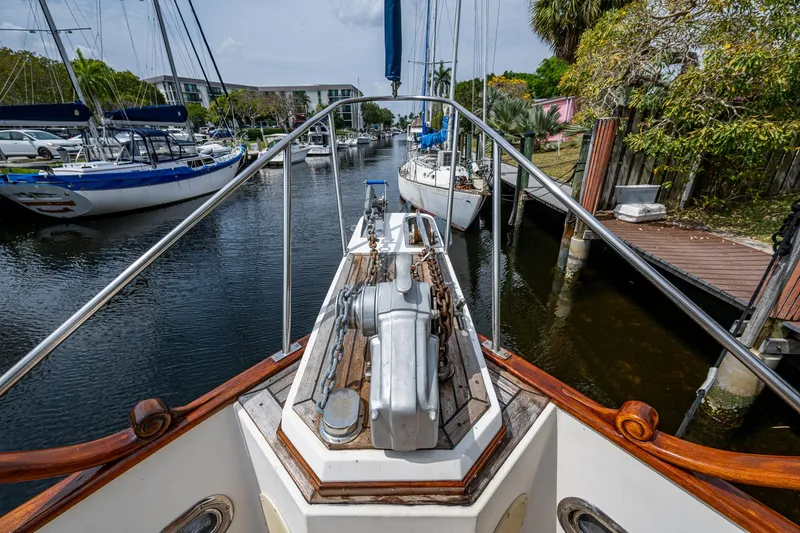 Slide: The Image of Bow view of 1990 Grand Banks 46 Classic yacht docked in a marina. - 9