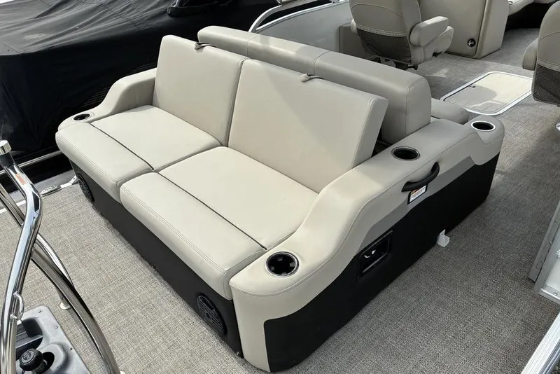 Slide: The Image of 2021 Barletta C22UC boat interior with beige seating and cup holders. - 10