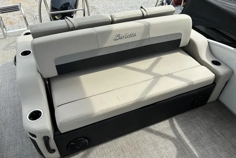 Slide: The Image of 2021 Barletta C22UC boat seating with cup holders and beige upholstery. - 2
