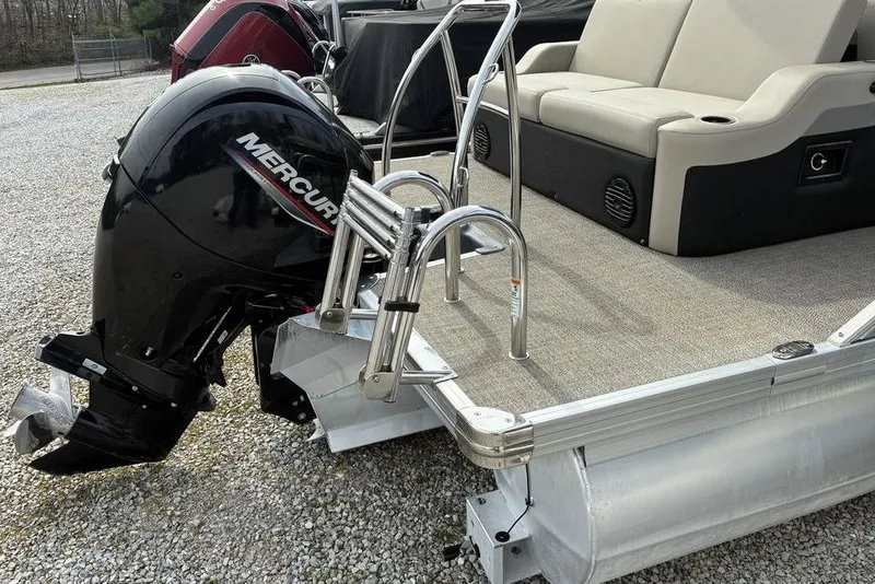 Slide: The Image of 2021 Barletta C22UC pontoon boat with Mercury outboard motor and seating area. - 8