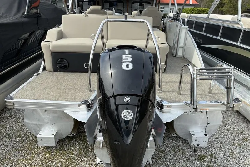 Slide: The Image of 2021 Barletta C22UC pontoon boat with a 50 HP engine, rear view. - 9