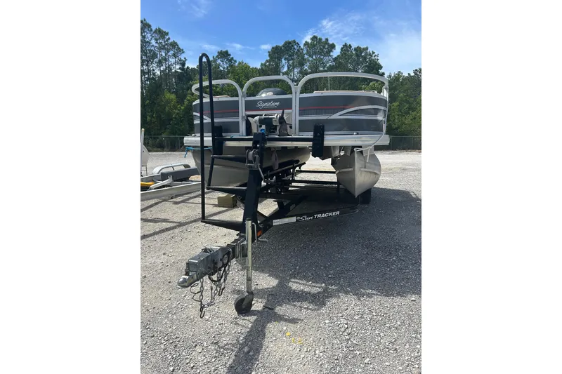 Slide: The Image of 2015 Sun Tracker Party Barge 22 Tritoon on trailer in outdoor setting. - 10