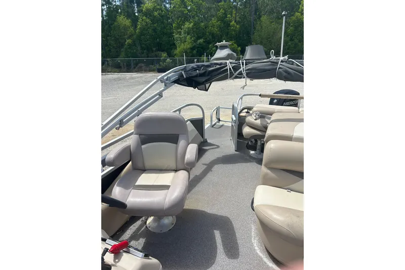Slide: The Image of 2015 Sun Tracker Party Barge 22 Tritoon interior with seating and canopy. - 11