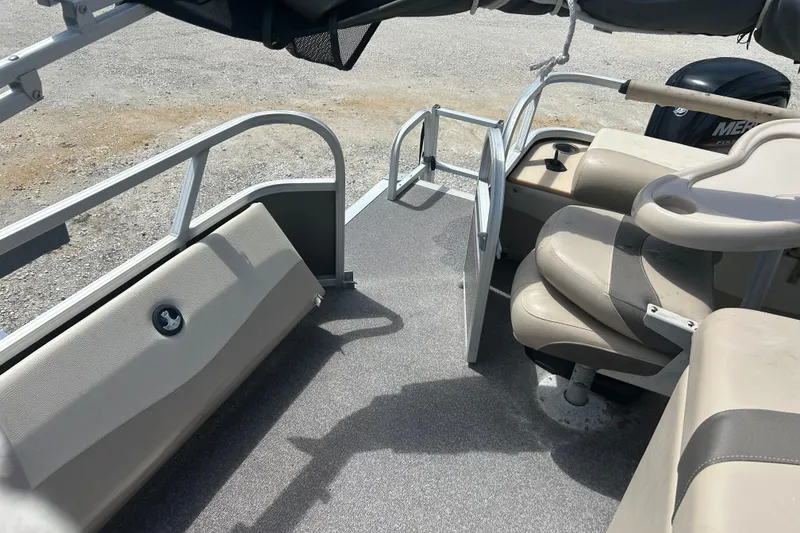 Slide: The Image of 2015 Sun Tracker Party Barge 22 Tritoon interior with seating and railing. - 19