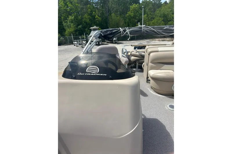 Slide: The Image of 2015 Sun Tracker Party Barge 22 Tritoon interior with seating and console. - 26