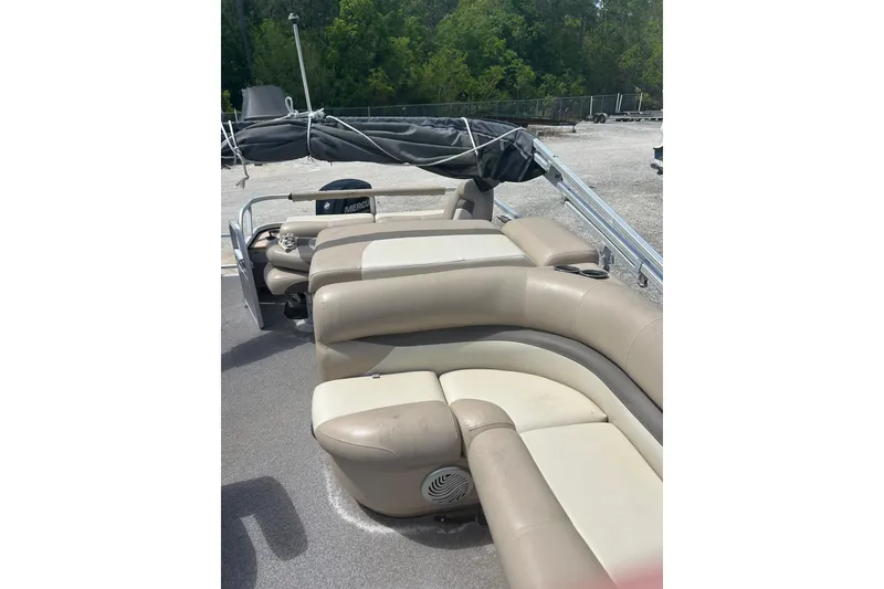 Slide: The Image of 2015 Sun Tracker Party Barge 22 Tritoon with beige seating and covered canopy. - 27