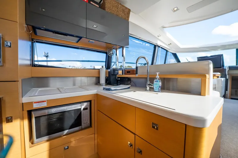 Slide: The Image of Luxurious kitchen area in a 2013 Prestige 500S yacht with modern amenities. - 10