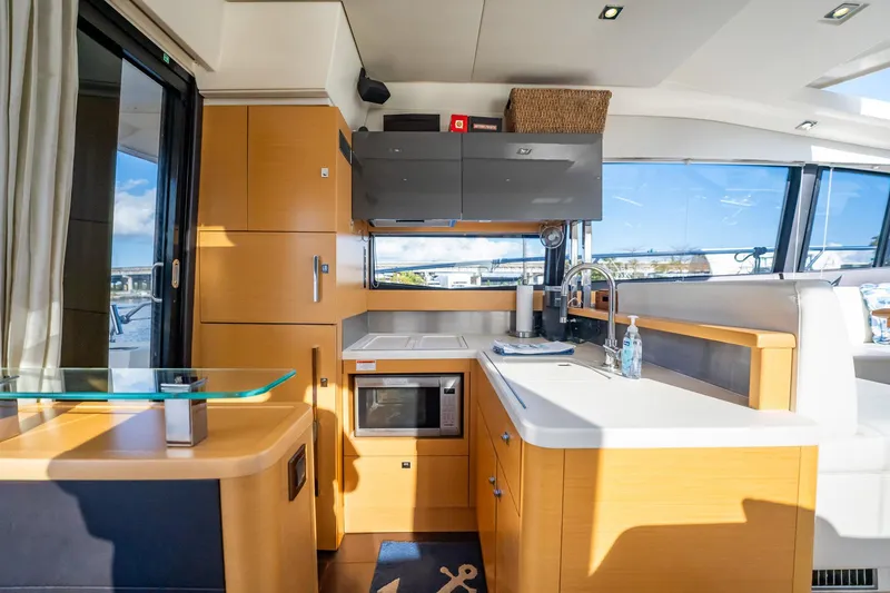 Slide: The Image of Luxurious interior of a 2013 Prestige 500S yacht, featuring a modern kitchen and sleek design. - 14