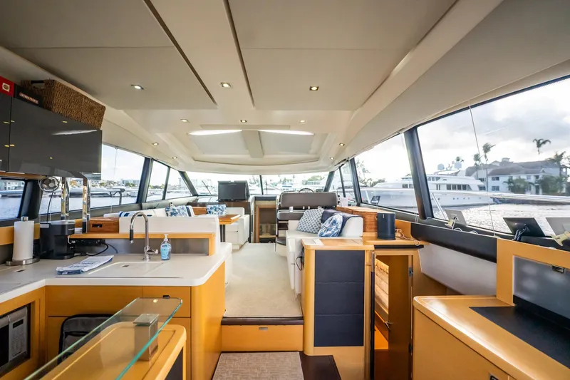 Slide: The Image of Luxurious interior of 2013 Prestige 500S yacht with modern kitchen and seating area. - 15