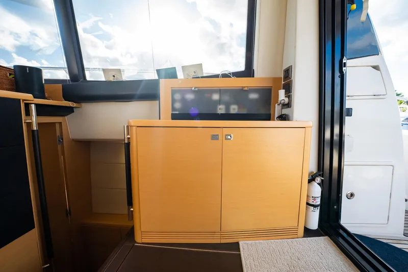 Slide: The Image of Interior of 2013 Prestige 500S yacht with wooden cabinetry and large windows. - 16