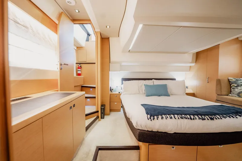 Slide: The Image of Luxurious cabin interior of 2013 Prestige 500S yacht with modern furnishings and cozy bed. - 18
