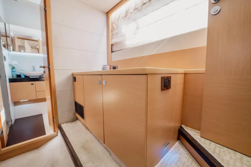 Slide: The Image of Interior of 2013 Prestige 500S yacht, featuring modern cabinetry and a sleek bathroom design. - 19