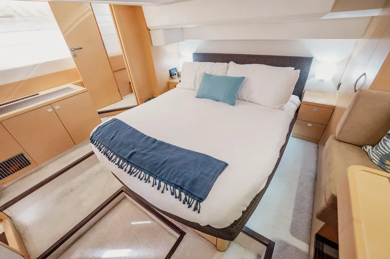 Slide: The Image of Luxurious bedroom interior of 2013 Prestige 500S yacht with modern furnishings. - 22