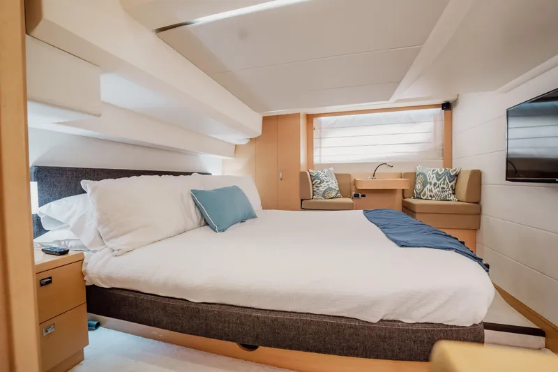 Slide: The Image of Luxurious cabin interior of 2013 Prestige 500S yacht with cozy bed and modern decor. - 26